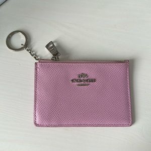 Coach pink mini pink keychain wallet.